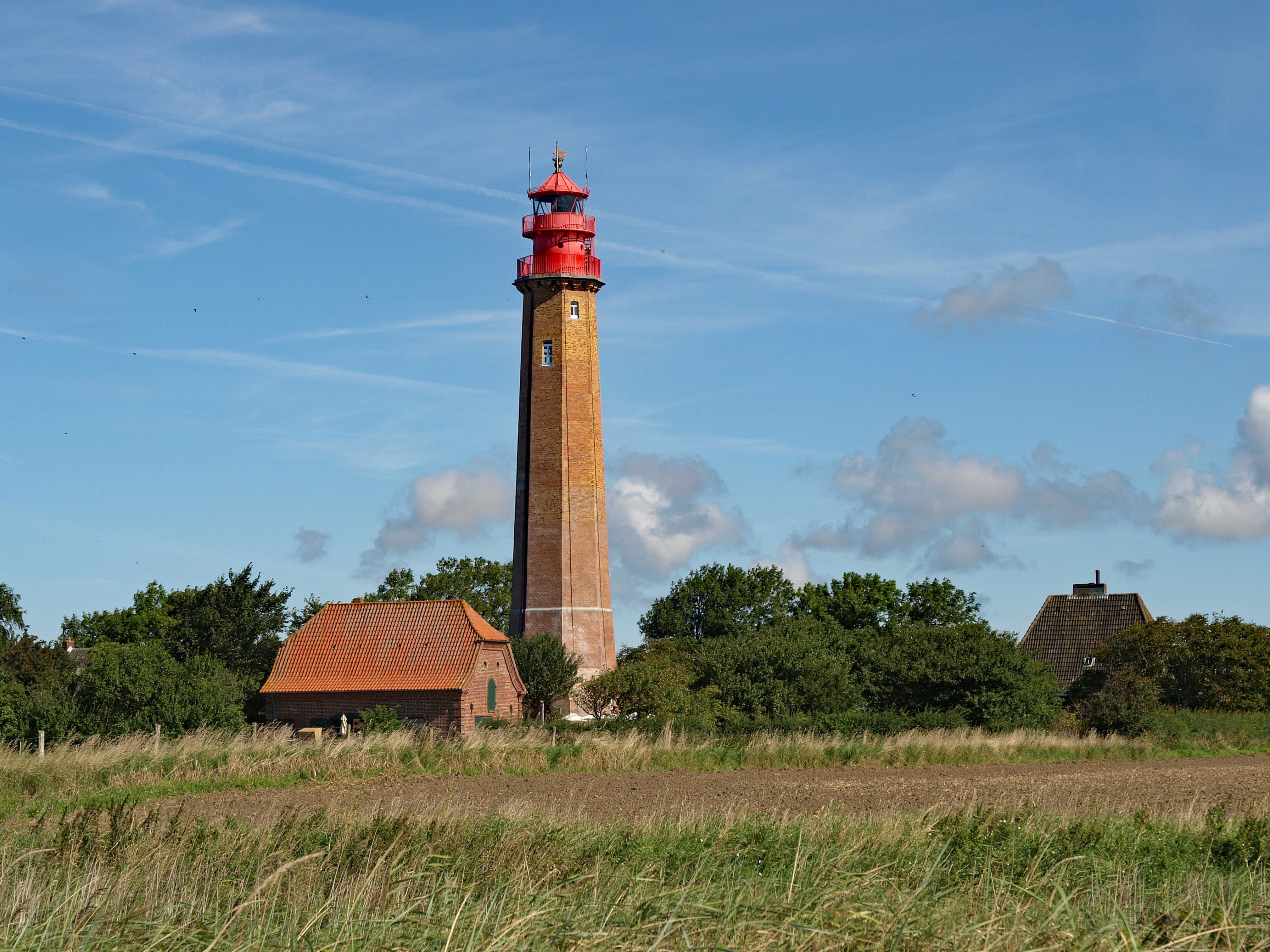 Red-and-white Flügge lighthouse on Fehmarn